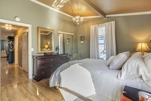 bedroom with an inviting chandelier, ornamental molding, light hardwood / wood-style flooring, and beamed ceiling