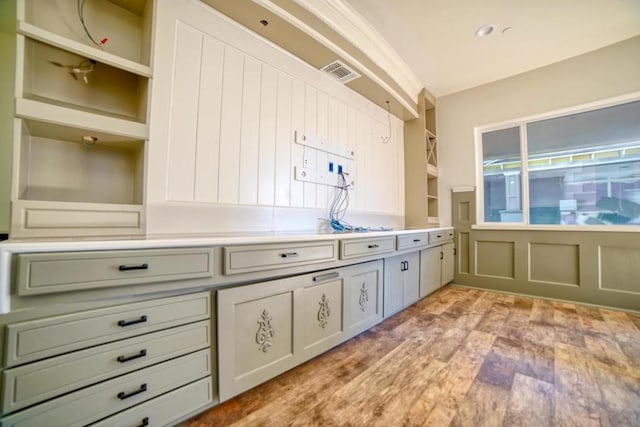 kitchen featuring light hardwood / wood-style flooring and built in shelves