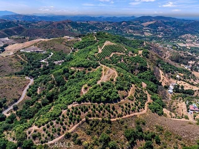 drone / aerial view featuring a mountain view