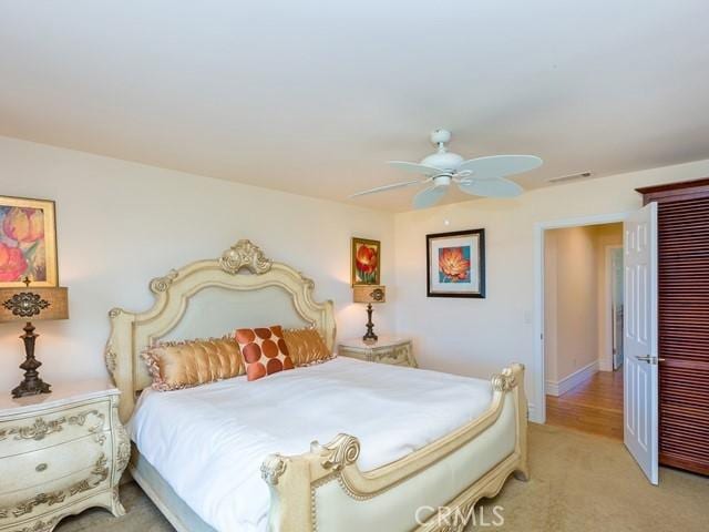 44665 La Cruz Dr, Temecula, CA 92590 - bedroom with a closet, light colored carpet, and a ceiling fan
