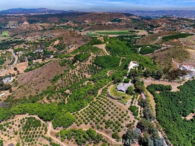 birds eye view of property featuring a rural view