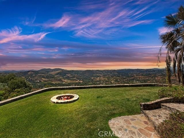 yard at dusk with a mountain view