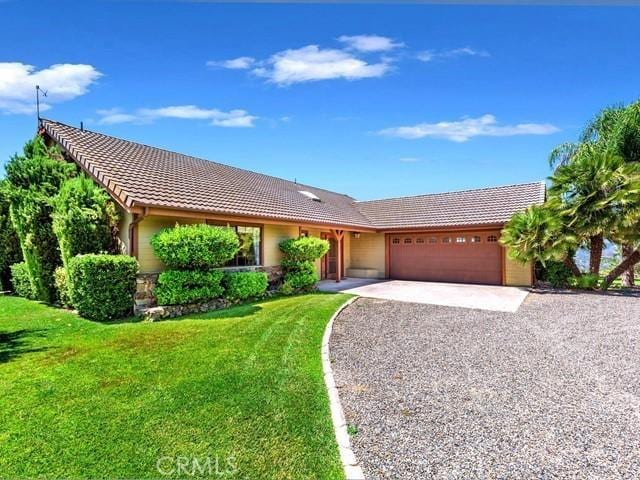 44665 La Cruz Dr, Temecula, CA 92590 - ranch-style home with a tile roof, an attached garage, driveway, and a front yard