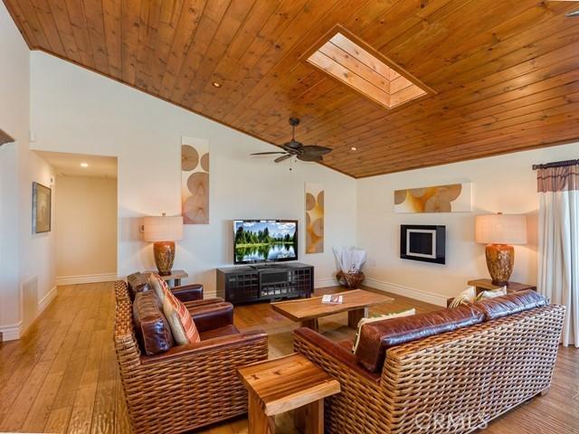 44665 La Cruz Dr, Temecula, CA 92590 - living room with wooden ceiling, vaulted ceiling, a skylight, hardwood / wood-style flooring, and a ceiling fan