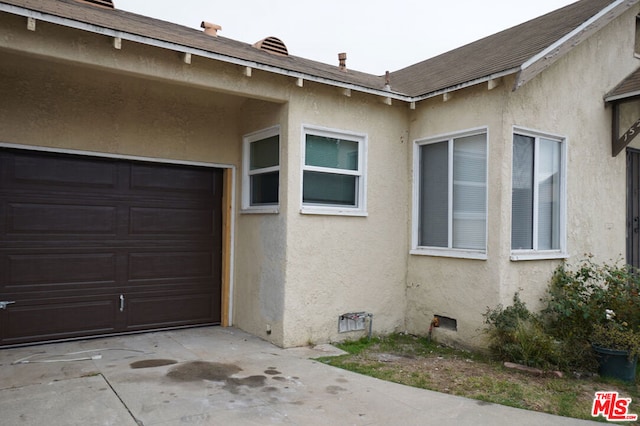 view of property exterior featuring a garage