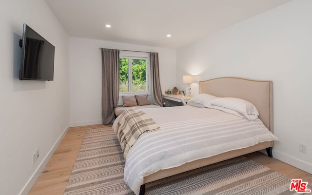 bedroom featuring light hardwood / wood-style floors