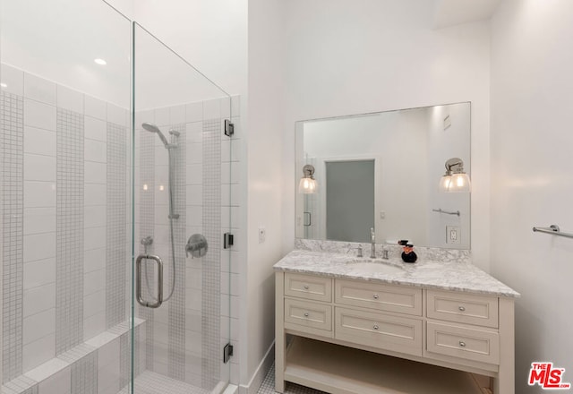 bathroom featuring vanity and walk in shower