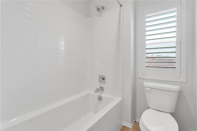 bathroom with toilet and shower / tub combination