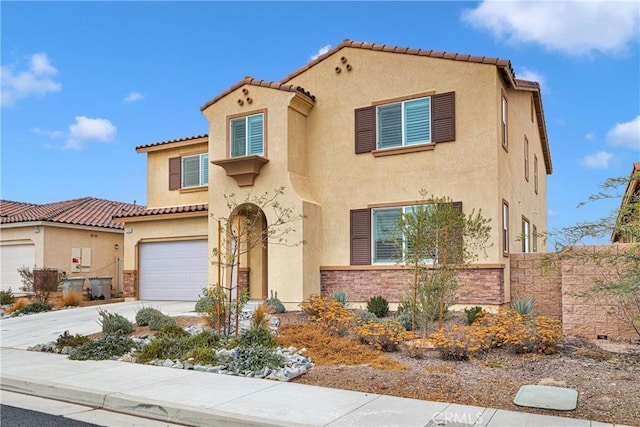 mediterranean / spanish-style house featuring a garage