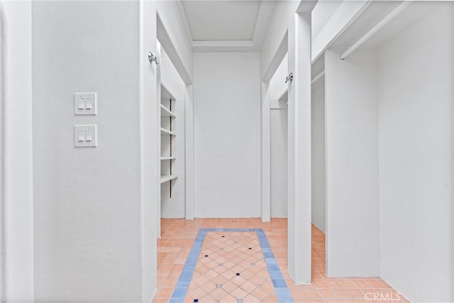 spacious closet with light tile patterned floors