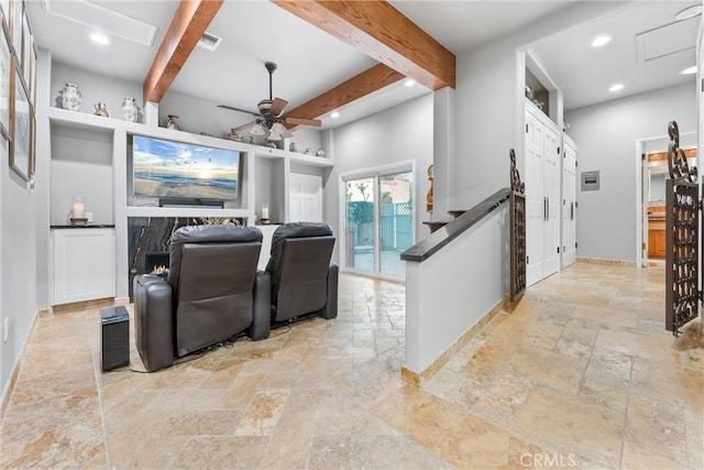 home theater room with beam ceiling and ceiling fan