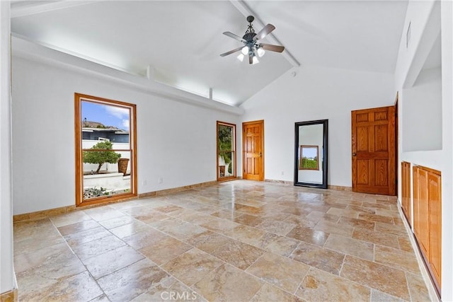 unfurnished room with beamed ceiling, high vaulted ceiling, and ceiling fan
