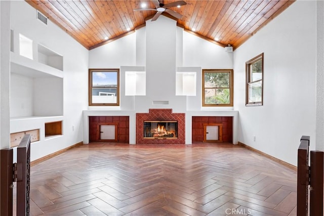 unfurnished living room featuring parquet flooring, a fireplace, high vaulted ceiling, and wooden ceiling