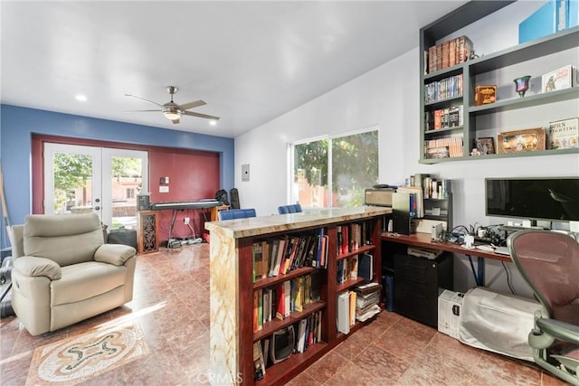 office area with plenty of natural light, ceiling fan, vaulted ceiling, and french doors