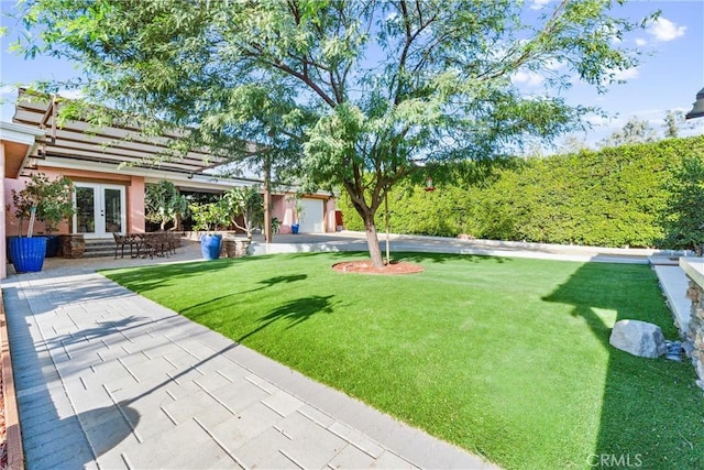 view of yard featuring french doors
