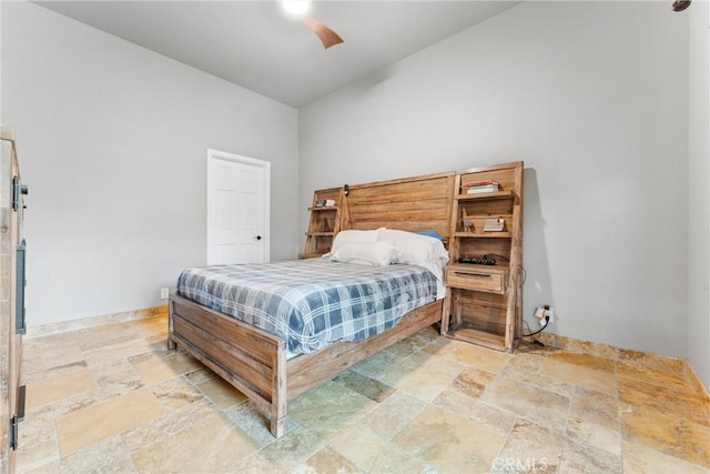 bedroom featuring vaulted ceiling and ceiling fan