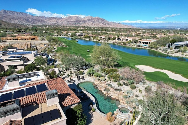 drone / aerial view featuring a water and mountain view