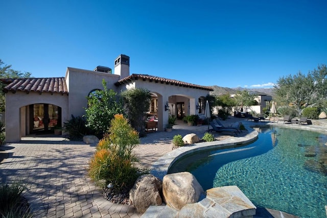 rear view of house featuring a patio area