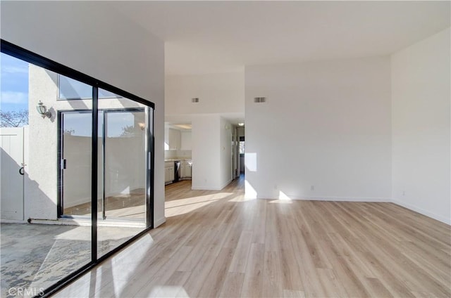 spare room with light hardwood / wood-style flooring