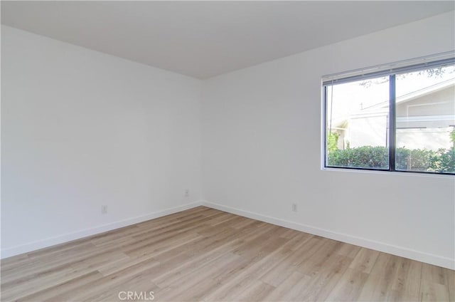 empty room with light wood-type flooring