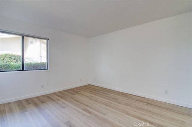 empty room with light hardwood / wood-style floors