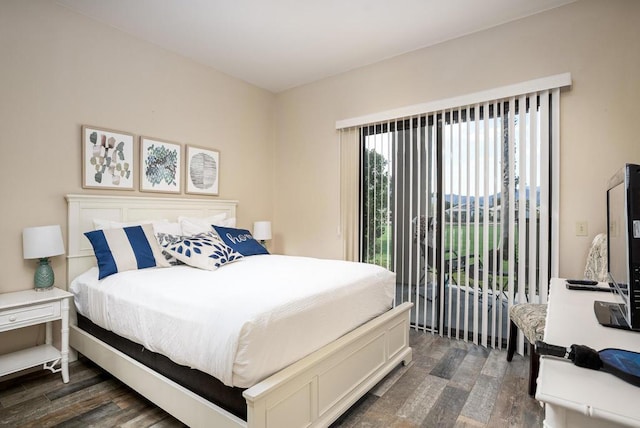 bedroom featuring access to outside and dark hardwood / wood-style floors