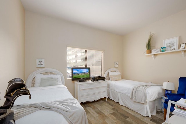 bedroom with hardwood / wood-style flooring