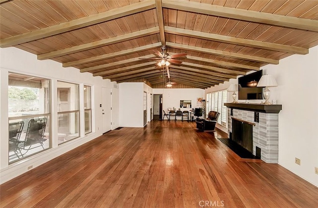 unfurnished living room with wooden ceiling, lofted ceiling with beams, hardwood / wood-style flooring, ceiling fan, and a fireplace