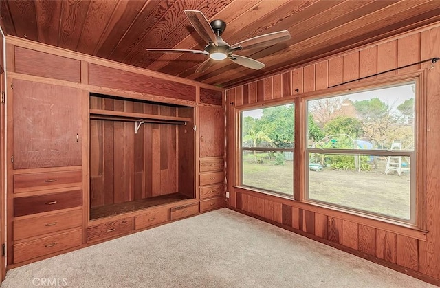 interior space featuring ceiling fan and wooden ceiling