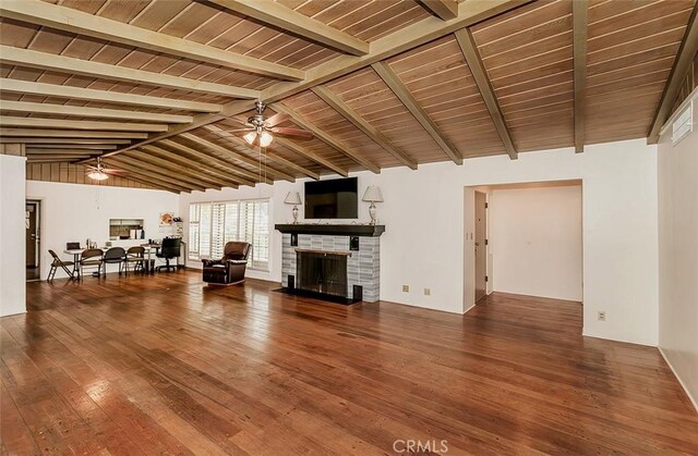 unfurnished living room featuring hardwood / wood-style floors, ceiling fan, lofted ceiling with beams, and wooden ceiling