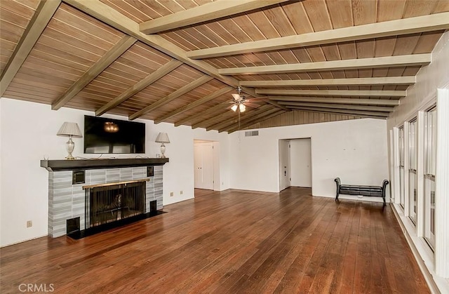 unfurnished living room with ceiling fan, wooden ceiling, hardwood / wood-style floors, vaulted ceiling with beams, and a tiled fireplace