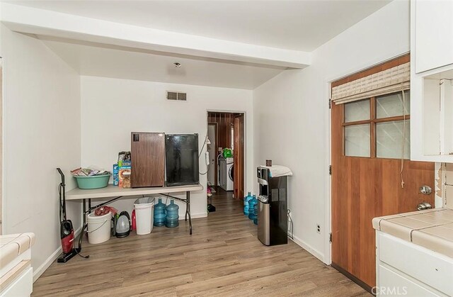 interior space featuring separate washer and dryer and light wood-type flooring