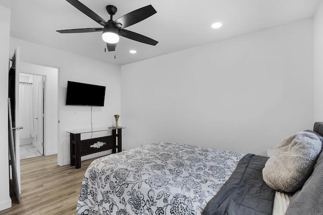 bedroom featuring ceiling fan and light hardwood / wood-style floors