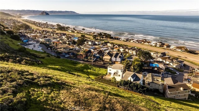 aerial view featuring a water view and a beach view