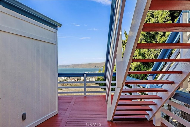 wooden deck with a mountain view