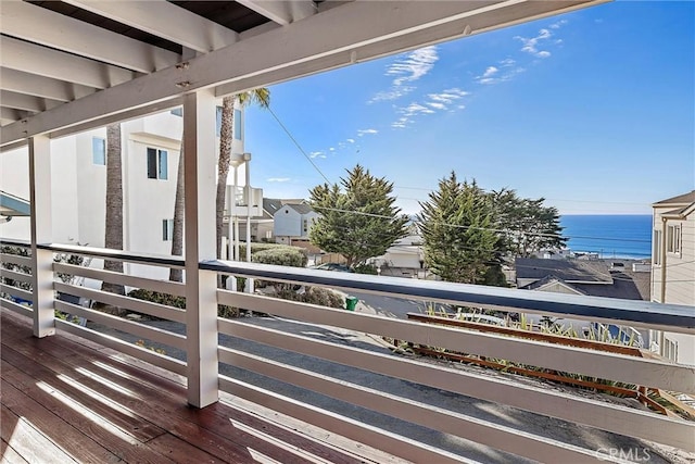 balcony featuring a water view