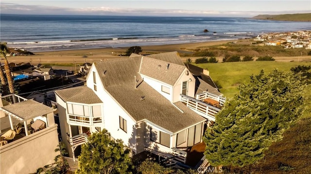 aerial view featuring a view of the beach and a water view