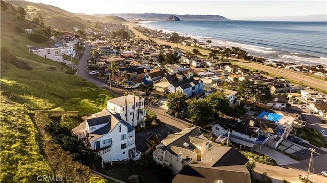 aerial view with a water view and a view of the beach