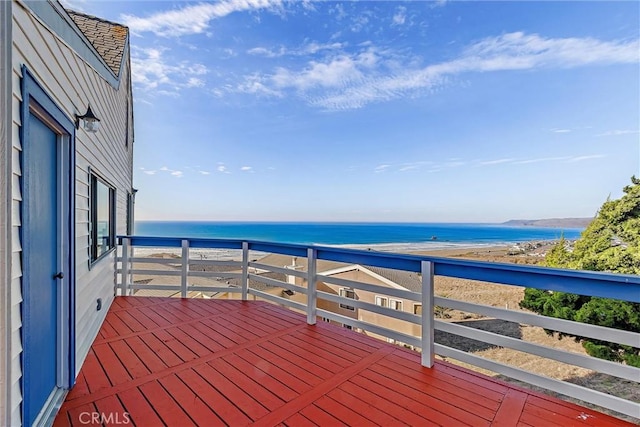 deck with a water view and a view of the beach