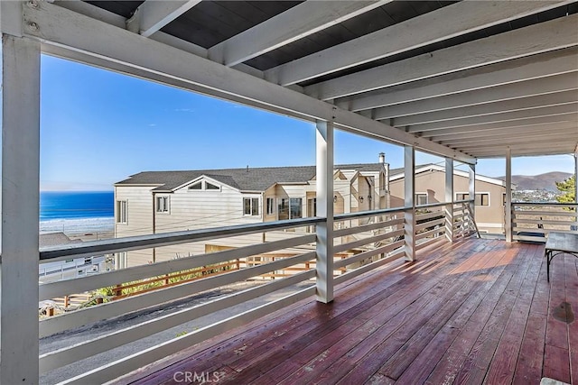 wooden deck with a water view