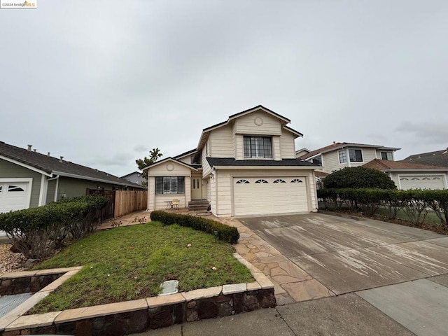 view of front facade with a front yard and a garage