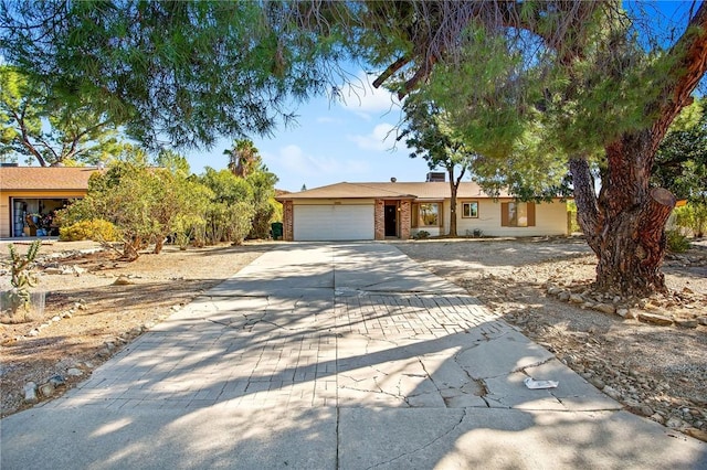 single story home with a garage