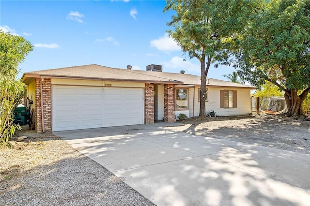 ranch-style home featuring a garage