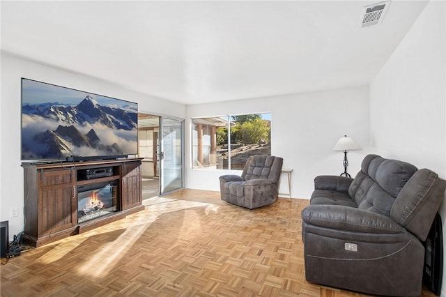 living room featuring light parquet flooring