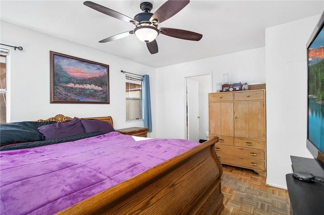 bedroom featuring dark parquet floors and ceiling fan