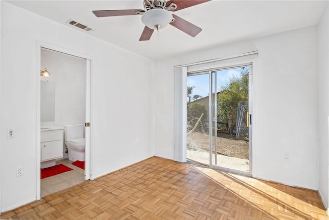 unfurnished room featuring ceiling fan and light parquet floors