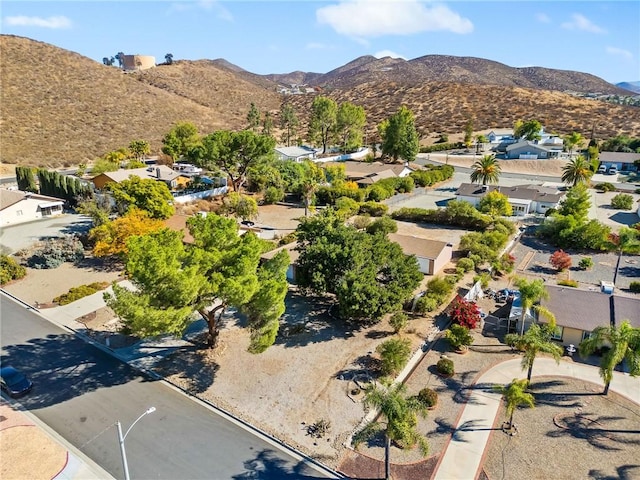 birds eye view of property with a mountain view