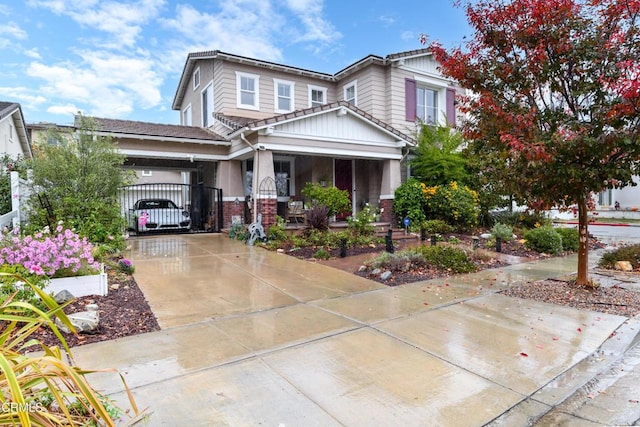 craftsman house with covered porch and a carport