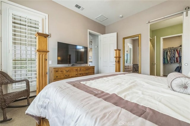 bedroom with carpet and a closet