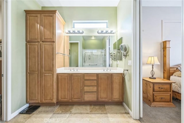 bathroom featuring vanity and an enclosed shower